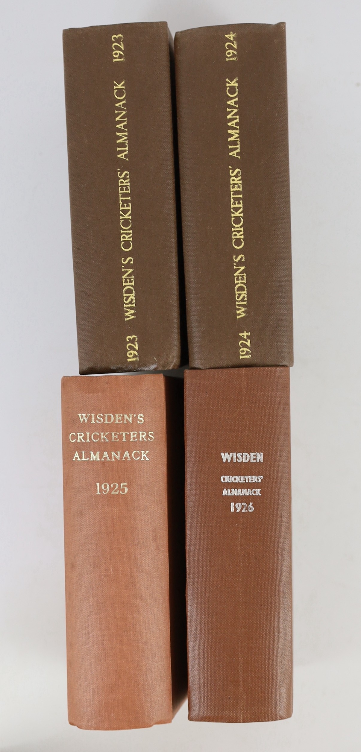 Wisden, John - Cricketers’ Almanack for the years 1919 (56th edition) - 1929 (66th edition), all rebound brown cloth gilt, and retaining original paper wrappers, bar issues of 1920-21, which lack wrappers and early adver